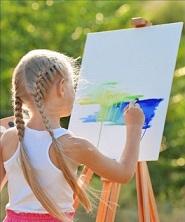 Girl painting outdoors